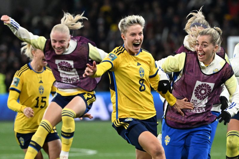 TOPSHOT - Sweden's forward #08 Lina Hurtig (C) and teammates celebrate their win during the Australia and New Zealand 2023 Women's World Cup round of 16 football match between Sweden and USA at Melbourne Rectangular Stadium in Melbourne on August 6, 2023. (Photo by WILLIAM WEST/AFP via Getty Images)