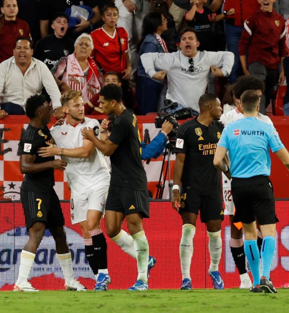 A Sevilla supporter makes racist gestures towards Vinicius Jr. (Photo via Vinicius Jr. on Twitter)