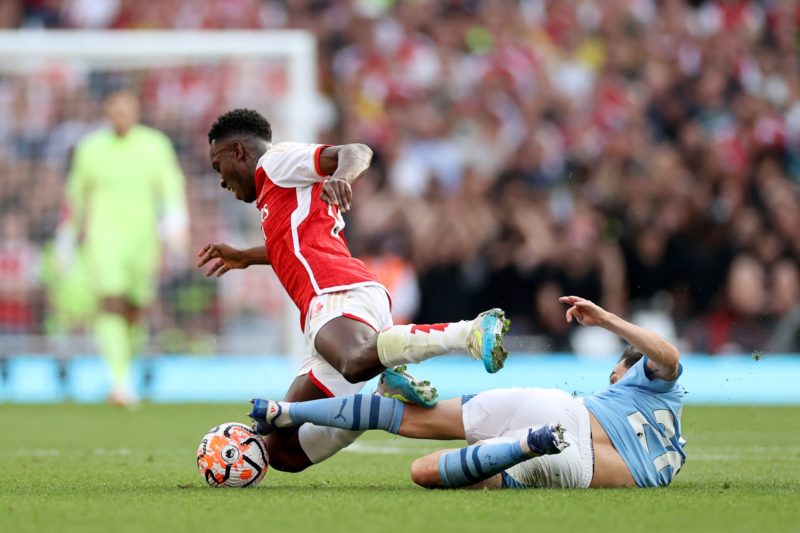 LONDON, ENGLAND - OCTOBER 08: Eddie Nketiah of Arsenal is tackled by Bernardo Silva of Manchester City during the Premier League match between Arsenal FC and Manchester City at Emirates Stadium on October 08, 2023 in London, England. (Photo by Ryan Pierse/Getty Images)