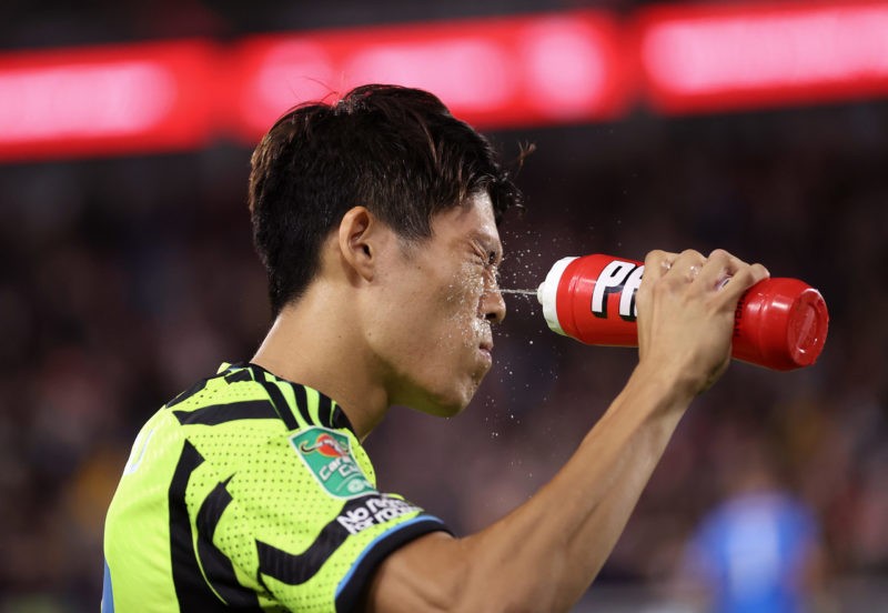 BRENTFORD, ENGLAND - SEPTEMBER 27: Takehiro Tomiyasu of Arsenal sprays water on his face during the Carabao Cup Third Round match between Brentford and Arsenal at Gtech Community Stadium on September 27, 2023 in Brentford, England. (Photo by Julian Finney/Getty Images)