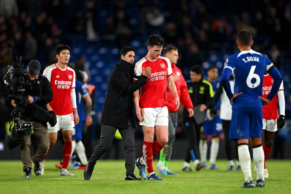 LONDON, ENGLAND: Mikel Arteta, Manager of Arsenal, interacts with Declan Rice of Arsenal following the Premier League match between Chelsea FC and Arsenal FC at Stamford Bridge on October 21, 2023. (Photo by Michael Regan/Getty Images)
