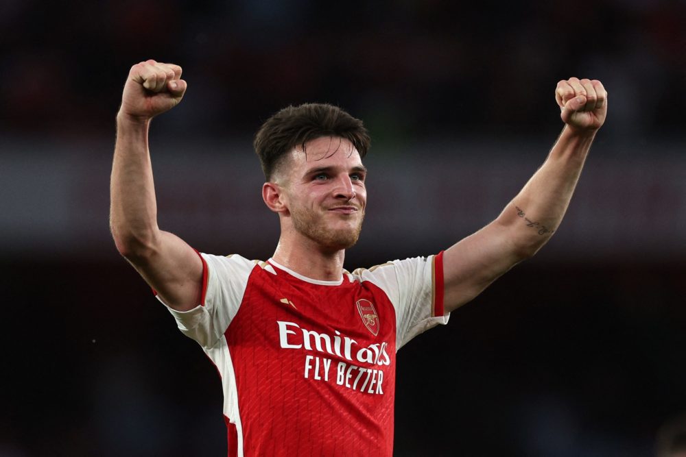 Arsenal's Declan Rice celebrates their victory on the pitch after the English Premier League football match between Arsenal and Manchester City at the Emirates Stadium in London on October 8, 2023. (Photo by ADRIAN DENNIS/AFP via Getty Images)