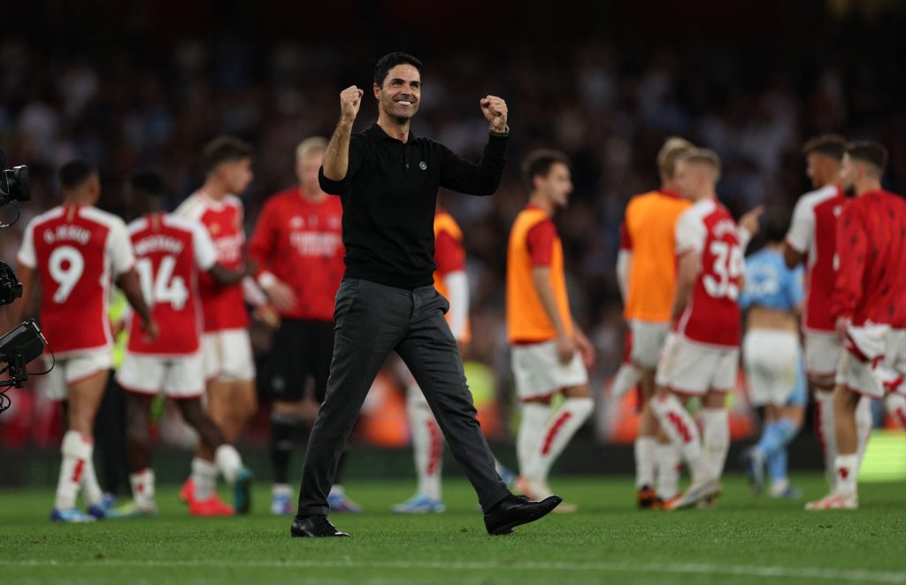 Arsenal's Spanish manager Mikel Arteta celebrates their victory on the pitch after the English Premier League football match between Arsenal and Manchester City at the Emirates Stadium in London on October 8, 2023. Arsenal won the game 1-0. (Photo by ADRIAN DENNIS/AFP via Getty Images)