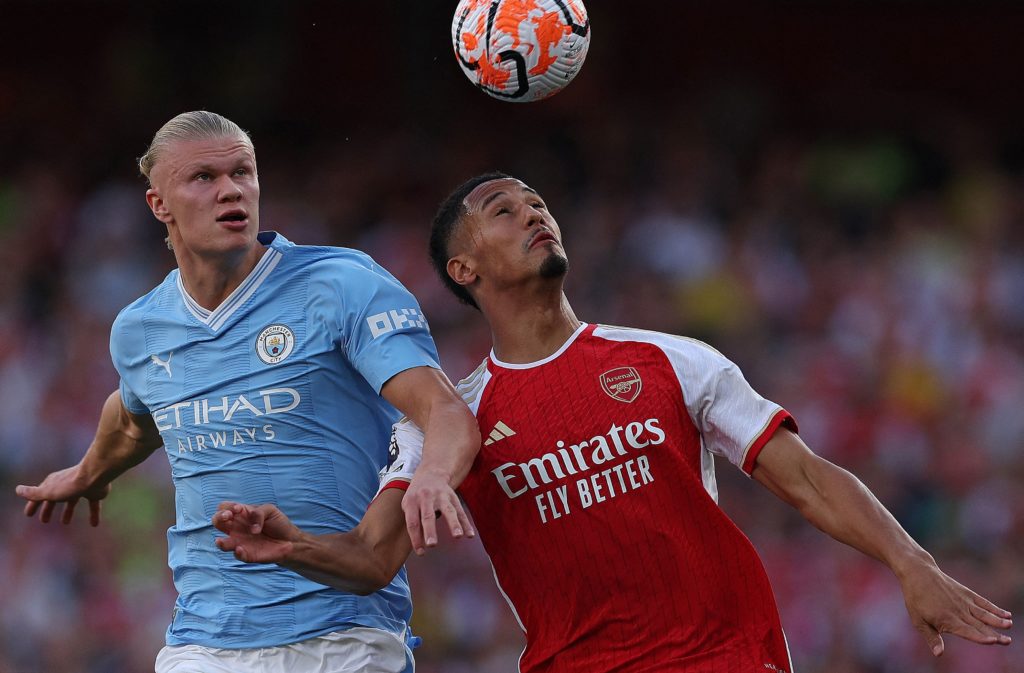 Manchester City's Norwegian striker #09 Erling Haaland (L) vies with Arsenal's French defender #02 William Saliba (R) during the English Premier League football match between Arsenal and Manchester City at the Emirates Stadium in London on October 8, 2023. (Photo by ADRIAN DENNIS/AFP via Getty Images)