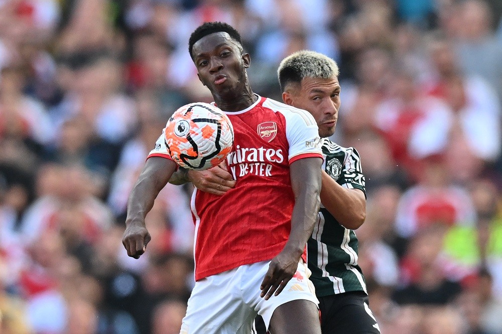 Arsenal's English striker #14 Eddie Nketiah (L) vies with Manchester United's Argentinian defender #06 Lisandro Martinez (R) during the English Premier League football match between Arsenal and Manchester United at the Emirates Stadium in London on September 3, 2023. (Photo by GLYN KIRK/AFP via Getty Images)