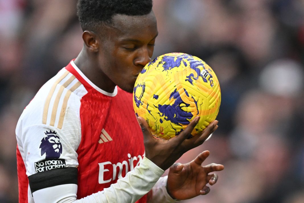 Arsenal's English striker #14 Eddie Nketiah kisses the match ball as he celebrates after scoring his, and their third goal during the English Premier League football match between Arsenal and Sheffield United at the Emirates Stadium in London on October 28, 2023. (Photo by GLYN KIRK/AFP via Getty Images)