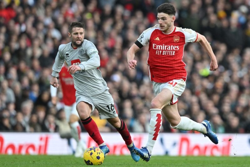 Arsenal's English midfielder #41 Declan Rice (R) runs with the ball during the English Premier League football match between Arsenal and Sheffield United at the Emirates Stadium in London on October 28, 2023. (Photo by GLYN KIRK/AFP via Getty Images)