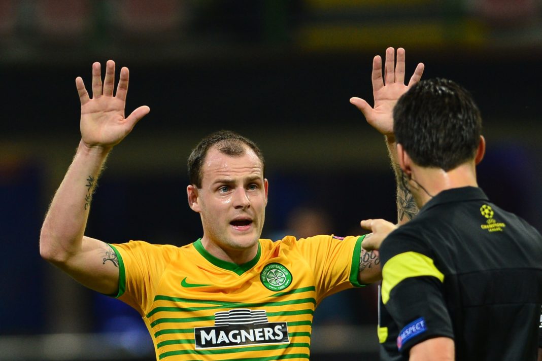 Celtic's forward of Ireland Anthony Stokes gestures in front of Referee Wolfgang Stark during the Champions League football match AC Milan vs Celtic Glagow on September 18, 2013 at San Siro Stadium in Milan. (Photo credit GIUSEPPE CACACE/AFP via Getty Images)