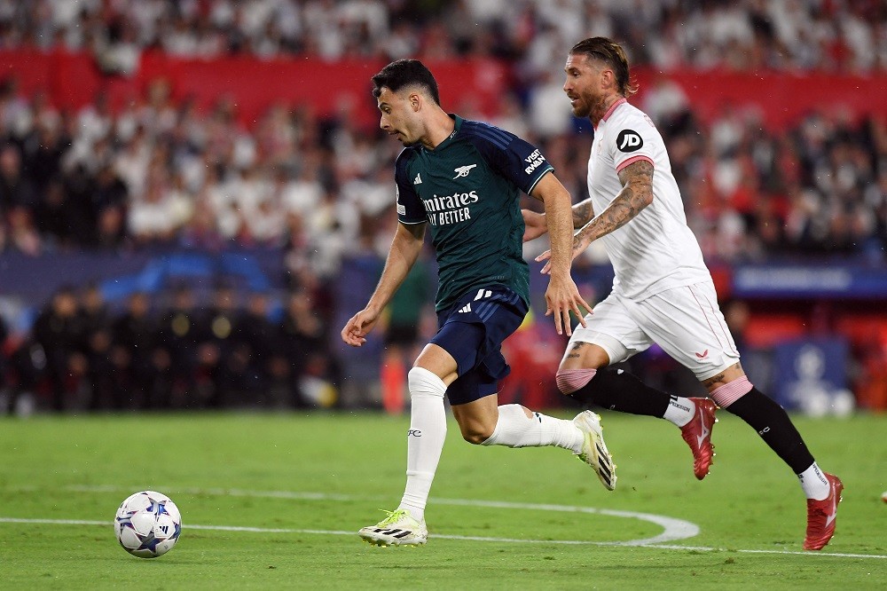Arsenal's Brazilian midfielder #11 Gabriel Martinelli (L) is challenged by Sevilla's Spanish defender #04 Sergio Ramos during the UEFA Champions League 1st round day 3 Group B football match between Sevilla FC and Arsenal at the Ramon Sanchez Pizjuan stadium in Seville on October 24, 2023. (Photo by JORGE GUERRERO/AFP via Getty Images)