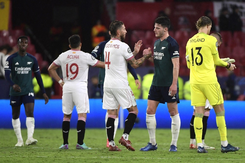 Sevilla's Spanish defender Sergio Ramos shakes hands with Arsenal's English midfielder #41 Declan Rice at the end of the UEFA Champions League 1st round day 3 Group B football match between Sevilla FC and Arsenal at the Ramon Sanchez Pizjuan stadium in Seville on October 24, 2023. (Photo by CRISTINA QUICLER/AFP via Getty Images)
