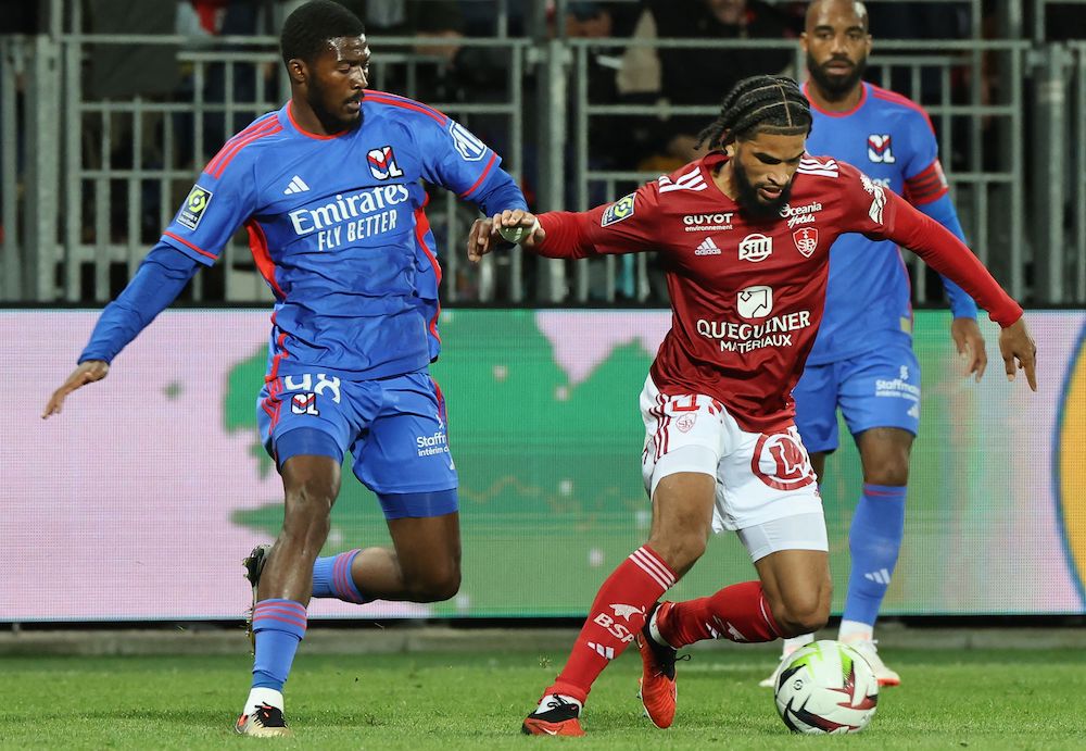 Brest's French midfielder #45 Mahdi Camara (R) fights for the ball with Lyon's English midfielder #98 Ainsley Maitland-Niles during the French L1 football match between Brest and Lyon at the Francis Le Ble stadium in Brest, western France on September 23, 2023. (Photo by FRED TANNEAU/AFP via Getty Images)