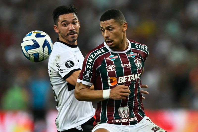 Olimpia's forward Walter Gonzalez (L) and Fluminense's midfielder Andre Trindade vie for the ball during the Copa Libertadores quarterfinals first leg football match between Brazil's Fluminense and Paraguay's Olimpia, at the Maracana stadium in Rio de Janeiro, Brazil, on August 24, 2023. (Photo by MAURO PIMENTEL/AFP via Getty Images)