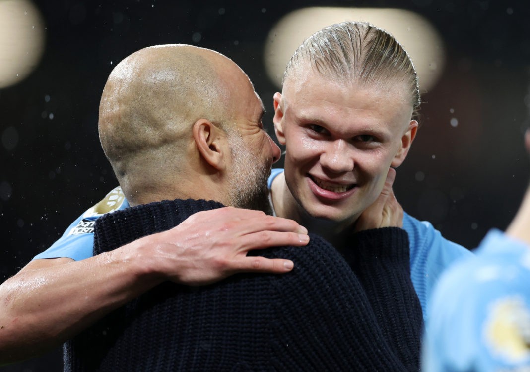MANCHESTER, ENGLAND - OCTOBER 29: Pep Guardiola, Manager of Manchester City, and Erling Haaland interact after the team's victory in the Premier League match between Manchester United and Manchester City at Old Trafford on October 29, 2023 in Manchester, England. (Photo by Catherine Ivill/Getty Images)