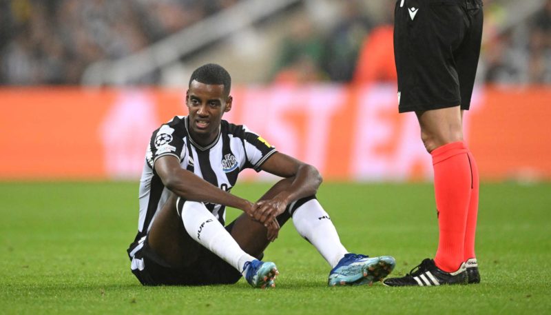 NEWCASTLE UPON TYNE, ENGLAND - OCTOBER 25: Newcastle player Alexander Isak reacts after injury forces him to leave the field during the UEFA Champions League match between Newcastle United FC and Borussia Dortmund at St. James Park on October 25, 2023 in Newcastle upon Tyne, England. (Photo by Stu Forster/Getty Images)