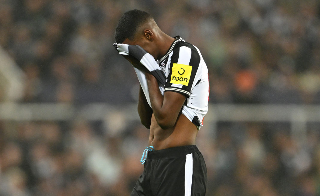 NEWCASTLE UPON TYNE, ENGLAND - OCTOBER 25: Newcastle player Alexander Isak reacts after injury forces him to leave the field during the UEFA Champions League match between Newcastle United FC and Borussia Dortmund at St. James Park on October 25, 2023 in Newcastle upon Tyne, England. (Photo by Stu Forster/Getty Images)