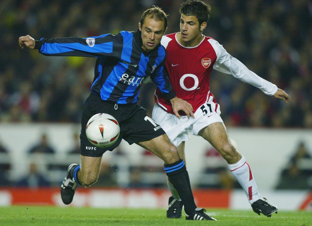 LONDON - OCTOBER 28: Paul Warne of Rotherham (L) United battles for the ball with Francesc Fabregas of Arsenal during the Carling Cup Third Round match between Arsenal and Rotherham United at Highbury on October 28, 2003 in London. (Photo by Ben Radford/Getty Images)