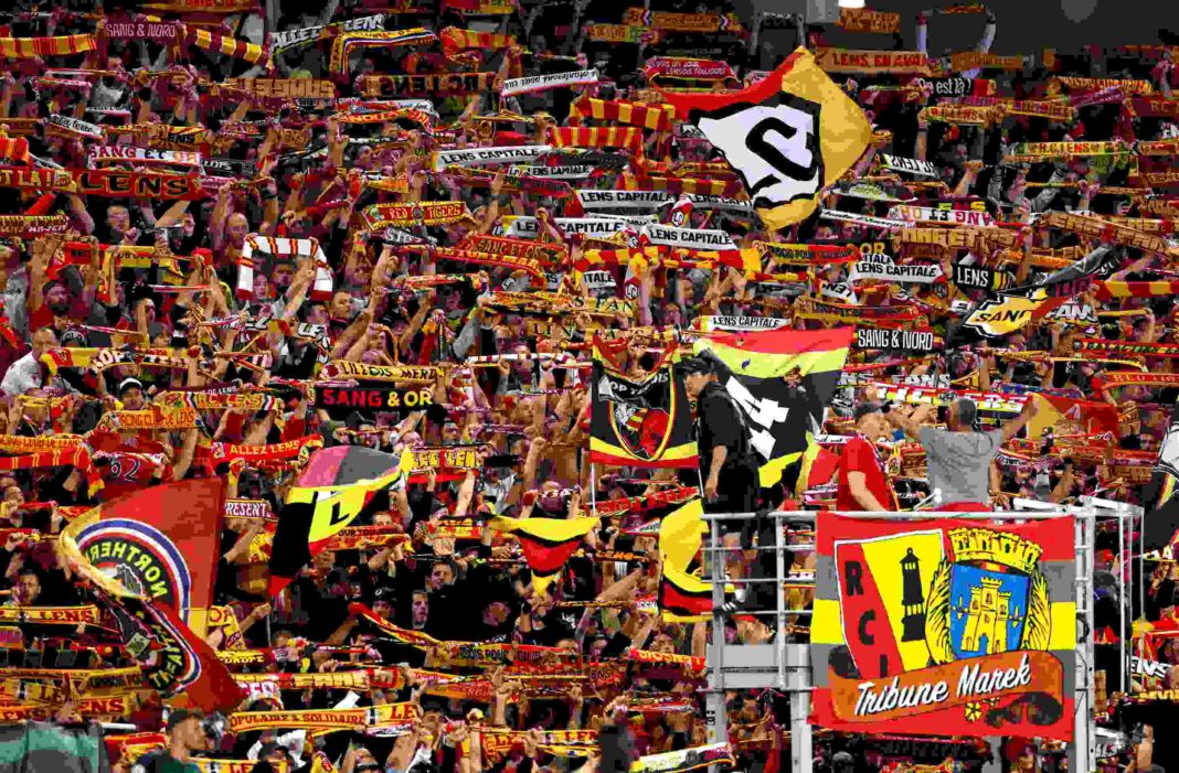 LENS, FRANCE - OCTOBER 03: Lens fans during the UEFA Champions League match between RC Lens and Arsenal FC at Stade Bollaert-Delelis on October 03, 2023 in Lens, France. (Photo by Alex Pantling/Getty Images)