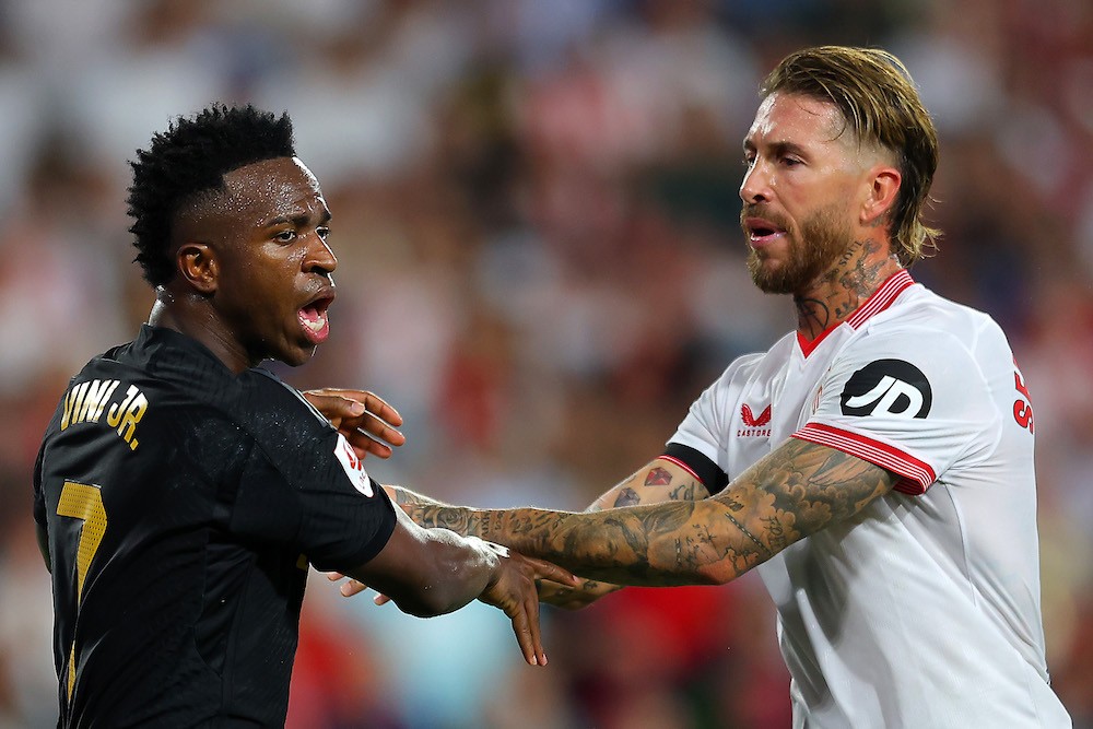 SEVILLE, SPAIN: Vinicius Junior of Real Madrid and Sergio Ramos of Sevilla FC clash during the LaLiga EA Sports match between Sevilla FC and Real Madrid CF at Estadio Ramon Sanchez Pizjuan on October 21, 2023. (Photo by Fran Santiago/Getty Images)