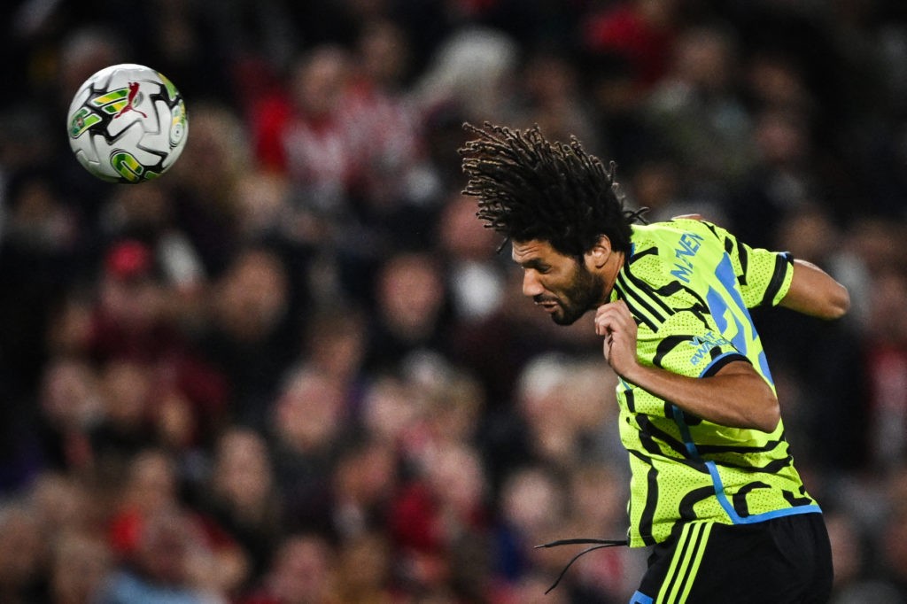 TOPSHOT - Arsenal's Egyptian midfielder #25 Mohamed Elneny heads the ball during the English League Cup third round football match between Brentford and Arsenal at the Brentford Community Stadium in London on September 27, 2023. (Photo by JUSTIN TALLIS/AFP via Getty Images)