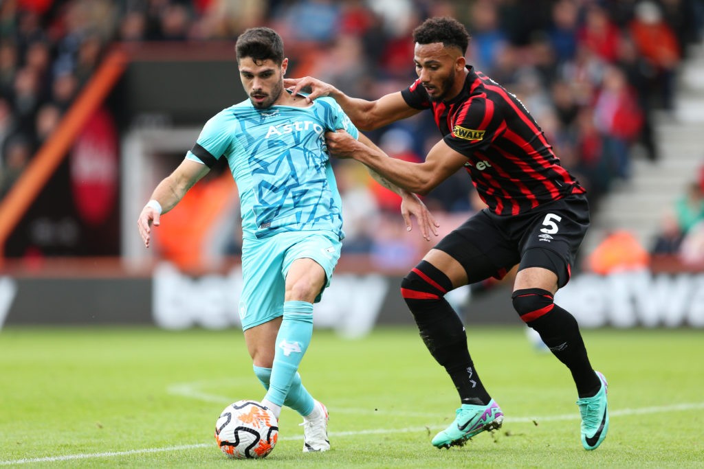 BOURNEMOUTH, ENGLAND - OCTOBER 21: Pedro Neto of Wolverhampton Wanderers is challenged by Lloyd Kelly of AFC Bournemouth during the Premier League match between AFC Bournemouth and Wolverhampton Wanderers at Vitality Stadium on October 21, 2023 in Bournemouth, England. (Photo by Steve Bardens/Getty Images)