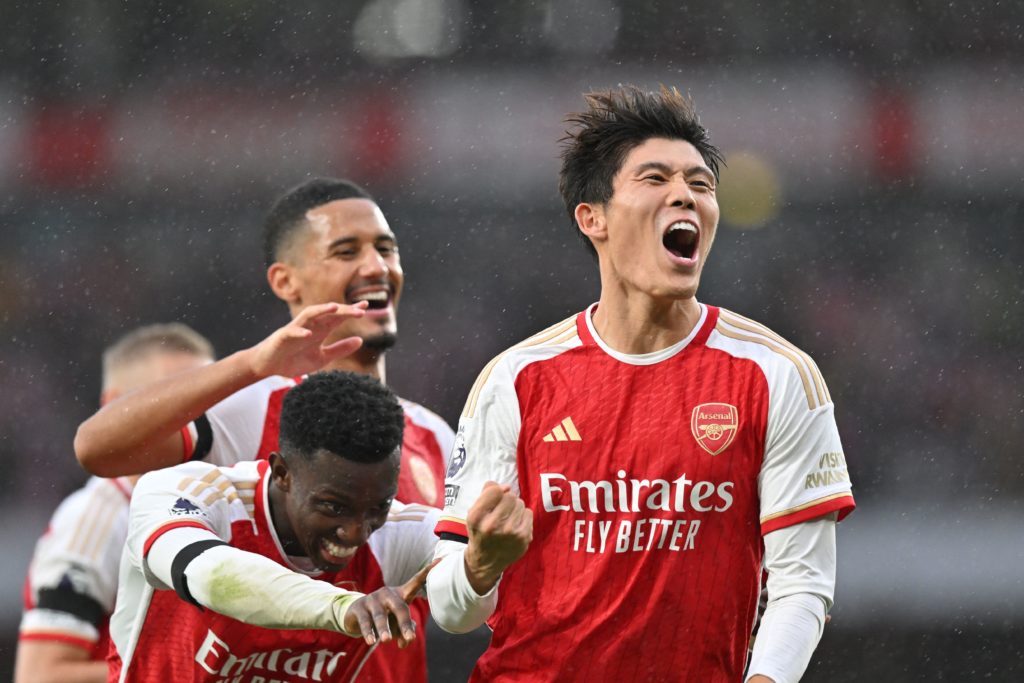 Arsenal's Japanese defender #18 Takehiro Tomiyasu (R) celebrates with teammates after scoring their fifth goal during the English Premier League football match between Arsenal and Sheffield United at the Emirates Stadium in London on October 28, 2023. (Photo by GLYN KIRK/AFP via Getty Images)