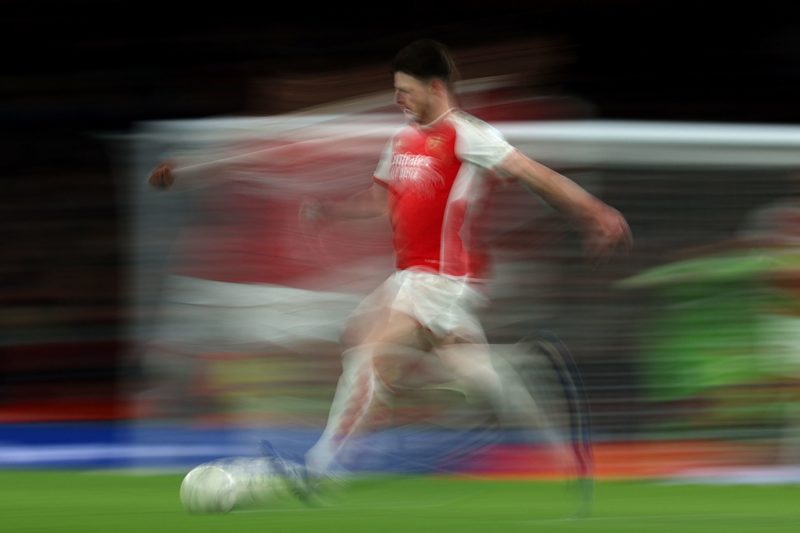 Arsenal's English midfielder #41 Declan Rice runs with the ball during the UEFA Champions League Group B football match between Arsenal and Sevilla at the Emirates Stadium in north London on November 8, 2023. (Photo by ADRIAN DENNIS/AFP via Getty Images)