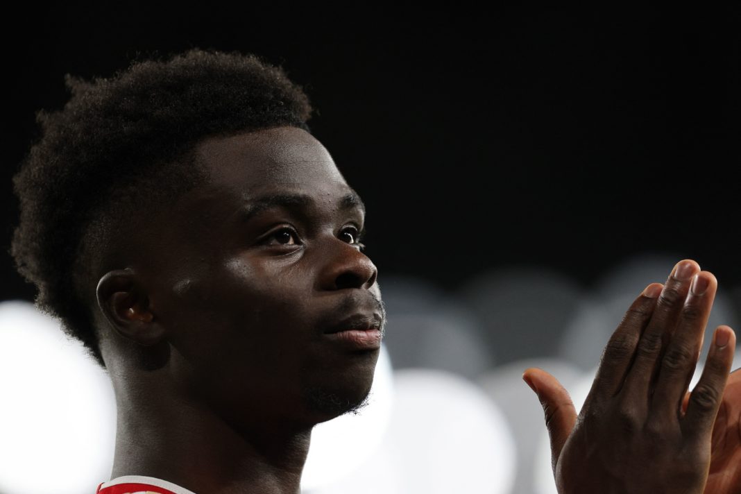 Arsenal's English midfielder #07 Bukayo Saka walks off the pitch after getting injured during the UEFA Champions League Group B football match between Arsenal and Sevilla at the Emirates Stadium in north London on November 8, 2023. (Photo by ADRIAN DENNIS/AFP via Getty Images)
