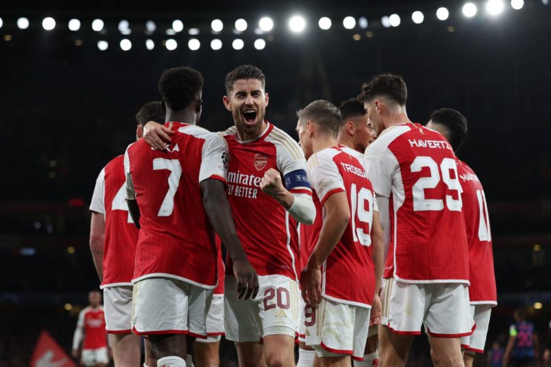 Arsenal's Italian midfielder #20 Jorginho (C) celebrates with teammates after their opening goal during the UEFA Champions League Group B football match between Arsenal and Sevilla at the Emirates Stadium in north London on November 8, 2023. (Photo by ADRIAN DENNIS/AFP via Getty Images)