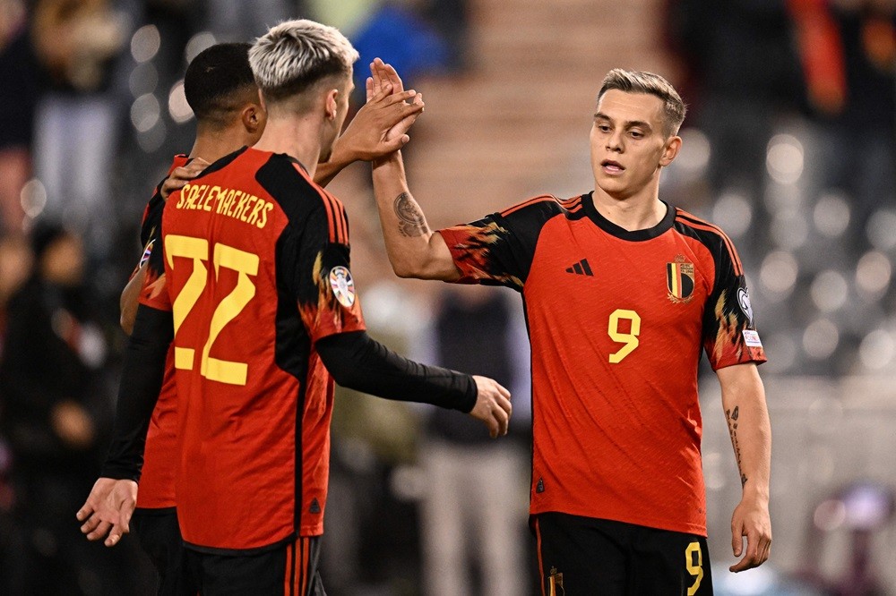 Belgium's Leandro Trossard (R) celebrates scoring his team's fifth goal during the UEFA Champions League Qualifying Group F football match between Belgium and Azerbaijan at The King Baudouin Stadium in Brussels, on November 19, 2023. (Photo by JOHN THYS/AFP via Getty Images)