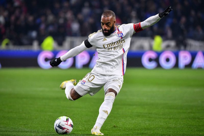 Lyon's French forward #10 Alexandre Lacazette takes a shot during the French L1 football match between Olympique Lyonnais (Lyon) and LOSC (Lille) at the Groupama stadium in Lyon, central eastern France on November 26, 2023. (Photo by ARNAUD FINISTRE/AFP via Getty Images)