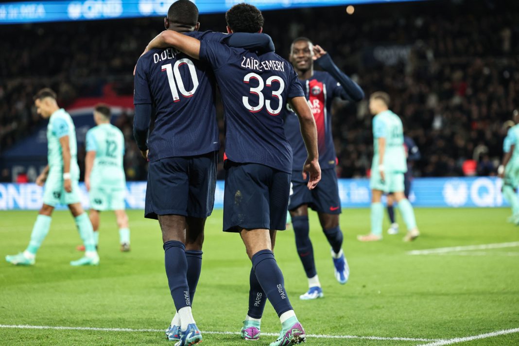 Paris Saint-Germain's French midfielder #33 Warren Zaire-Emery celebrates scoring his team's second goal with Paris Saint-Germain's French forward #10 Ousmane Dembele during the French L1 football match between Paris Saint-Germain (PSG) and Montpellier Herault SC at The Parc des Princes Stadium in Paris on November 3, 2023. (Photo by FRANCK FIFE/AFP via Getty Images)