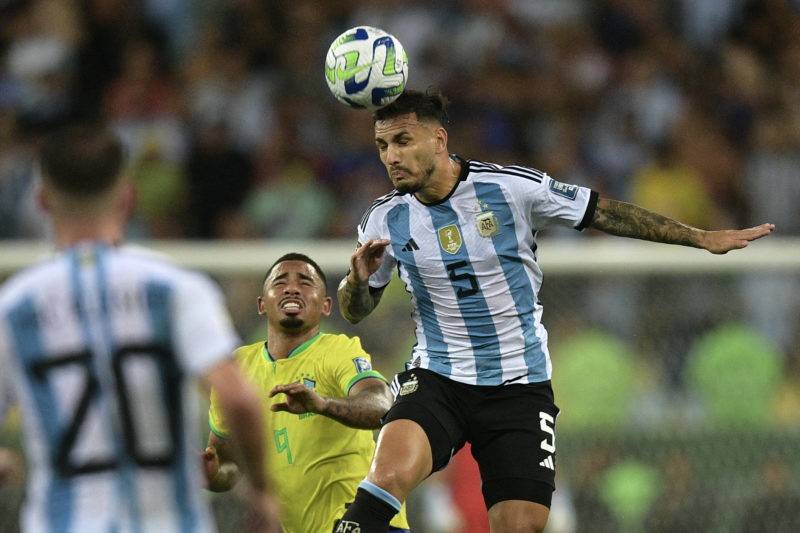 Argentina's midfielder Leandro Paredes (R) heads the ball past Brazil's forward Gabriel Jesus during the 2026 FIFA World Cup South American qualification football match between Brazil and Argentina at Maracana Stadium in Rio de Janeiro, Brazil, on November 21, 2023. (Photo by CARL DE SOUZA / AFP) (Photo by CARL DE SOUZA/AFP via Getty Images)