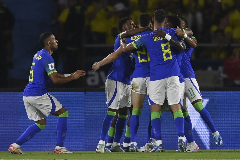 Brazilian players celebrate after forward Gabriel Martinelli scored during the 2026 FIFA World Cup South American qualification football match between Colombia and Brazil at the Roberto Melendez Metropolitan Stadium in Barranquilla, Colombia, on November 16, 2023. (Photo by JUAN BARRETO/AFP via Getty Images)