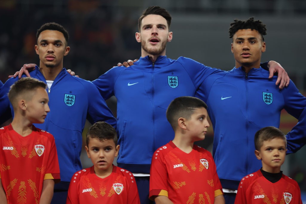 SKOPJE, MACEDONIA - NOVEMBER 20: Trent Alexander-Arnold, Declan Rice and Ollie Watkins of England sing their national anthem prior to the UEFA EURO 2024 European qualifier match between North Macedonia and England at National Arena Todor Proeski on November 20, 2023 in Skopje, Macedonia. (Photo by Alex Grimm/Getty Images)