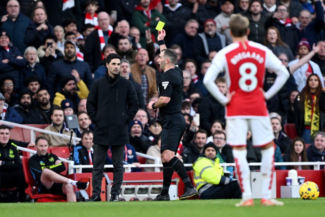 LONDON, ENGLAND - DECEMBER 17: Referee Tim Robinson shows a yellow card to Mikel Arteta, Manager of Arsenal, during the Premier League match between Arsenal FC and Brighton & Hove Albion at Emirates Stadium on December 17, 2023 in London, England. (Photo by Mike Hewitt/Getty Images)