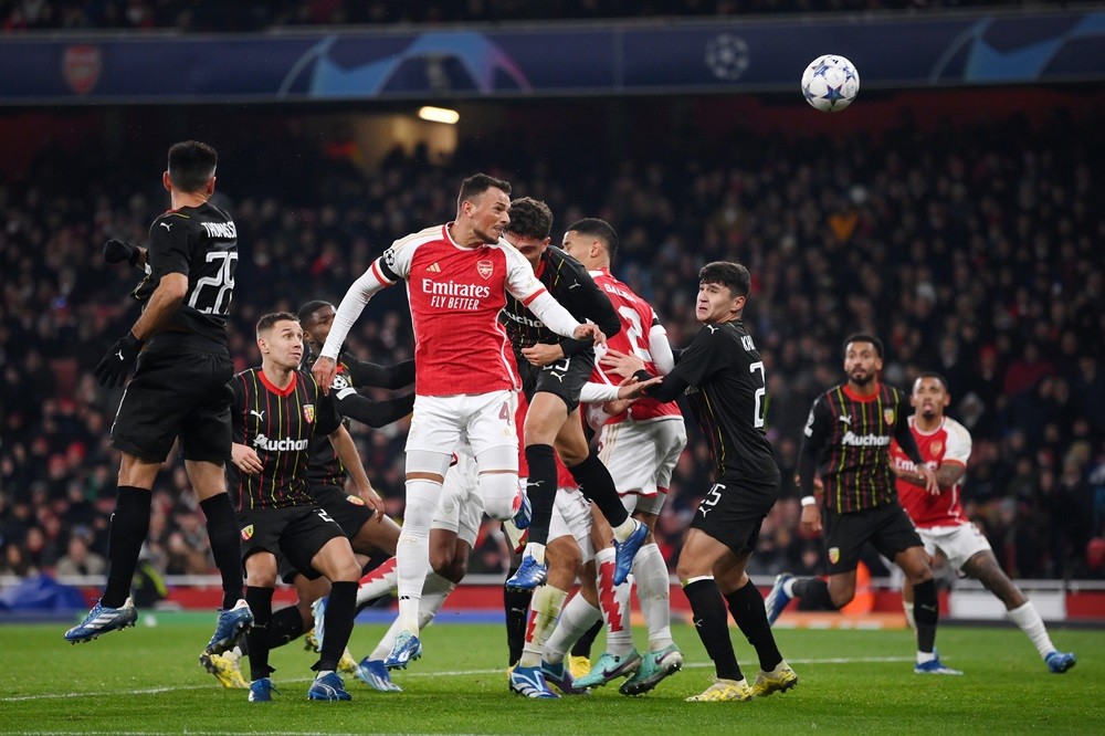 LONDON, ENGLAND: Ben White of Arsenal heads the ball during the UEFA Champions League match between Arsenal FC and RC Lens at Emirates Stadium on November 29, 2023. (Photo by Mike Hewitt/Getty Images)