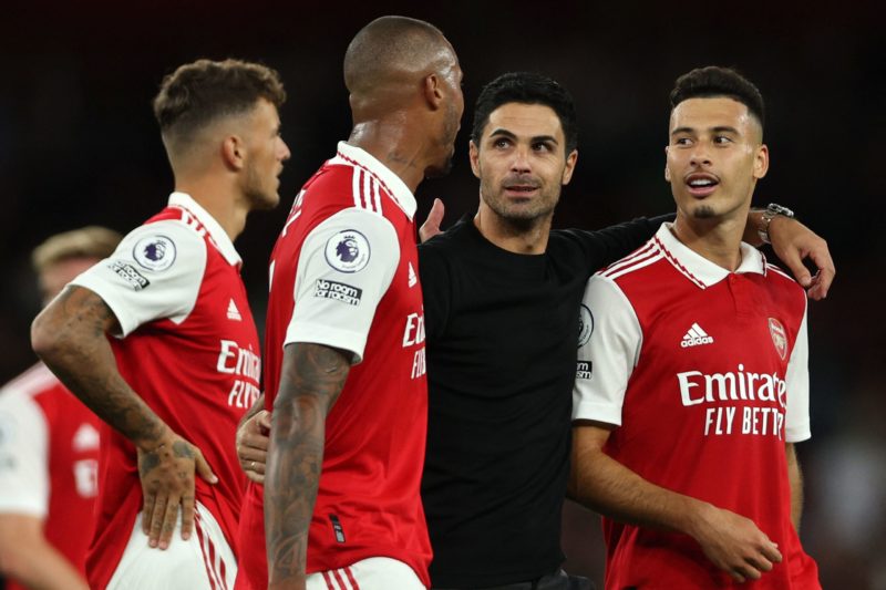 Arsenal's Spanish manager Mikel Arteta (2R) walks off of the pitch with Arsenal's Brazilian defender Gabriel Magalhaes (C) and Arsenal's Brazilian midfielder Gabriel Martinelli (R) following the English Premier League football match between Arsenal and Aston Villa at the Emirates Stadium in London on August 31, 2022. (Photo by ADRIAN DENNIS/AFP via Getty Images)