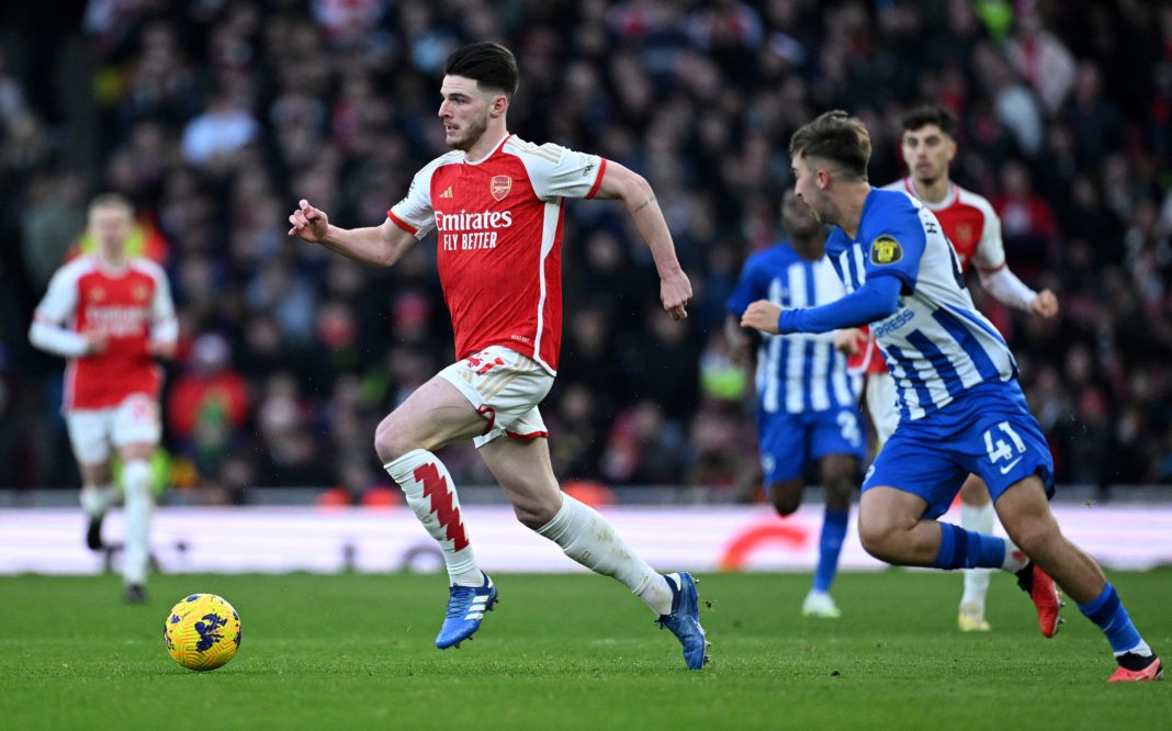 Brighton's English midfielder #41 Jack Hinshelwood (R) chases Arsenal's English midfielder #41 Declan Rice during the English Premier League football match between Arsenal and Brighton and Hove Albion at the Emirates Stadium in London on December 17, 2023. (Photo by JUSTIN TALLIS/AFP via Getty Images)