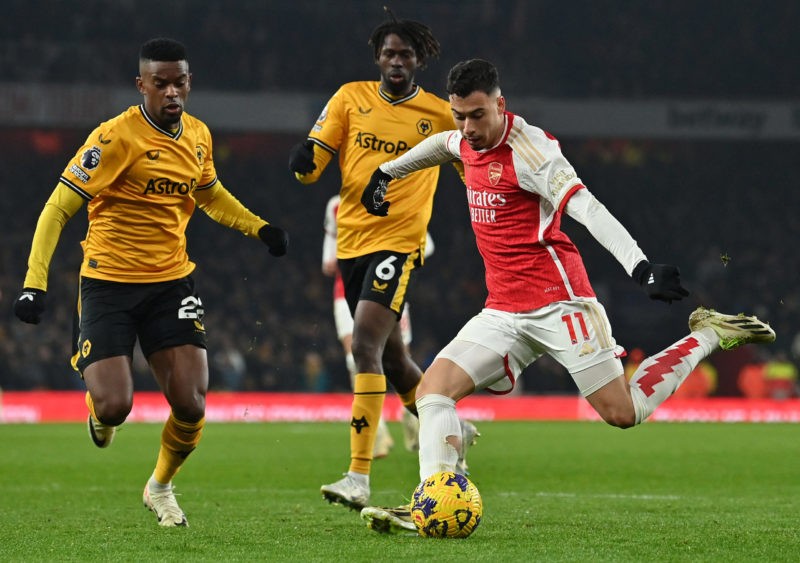 Arsenal's Brazilian midfielder #11 Gabriel Martinelli (R) crosses the ball during the English Premier League football match between Arsenal and Wolverhampton Wanderers at the Emirates Stadium in London on December 2, 2023. (Photo by GLYN KIRK/AFP via Getty Images)