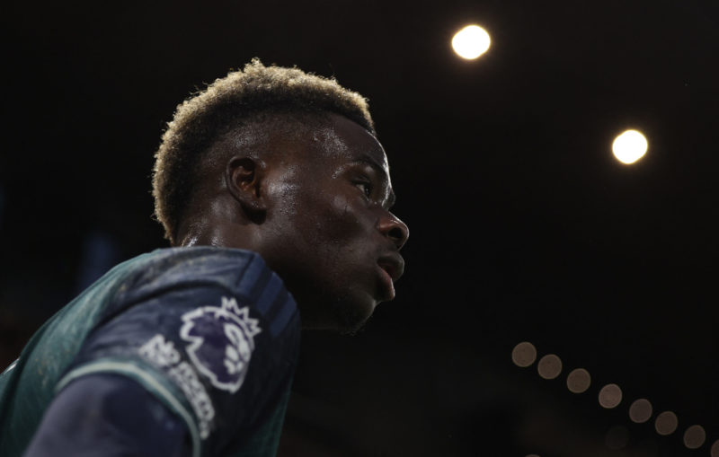 Arsenal's English midfielder #07 Bukayo Saka prpares to take a corner kick during the English Premier League football match between Fulham and Arsenal at Craven Cottage in London on December 31, 2023. (Photo by ADRIAN DENNIS/AFP via Getty Images)