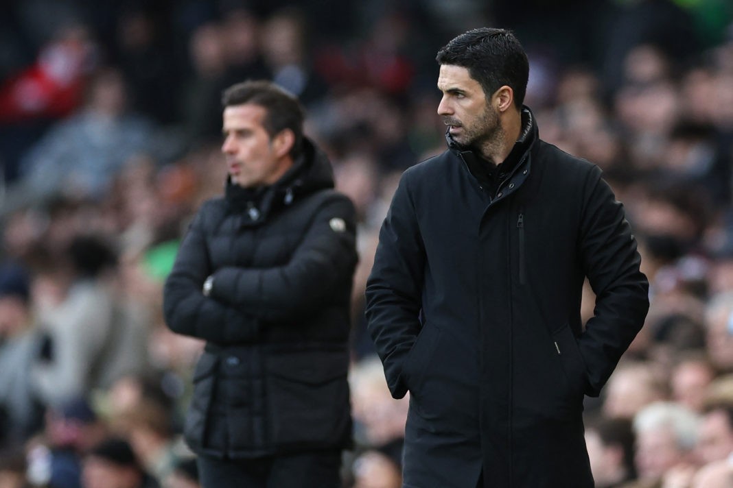 Fulham's Portuguese head coach Marco Silva (L) and Arsenal's Spanish manager Mikel Arteta (R) look on during the English Premier League football match between Fulham and Arsenal at Craven Cottage in London on December 31, 2023. (Photo by ADRIAN DENNIS/AFP via Getty Images)