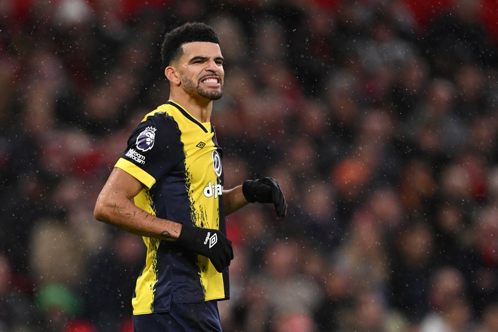 Bournemouth's Dominic Solanke reacts after hitting the post during the English Premier League football match between Manchester United and Bournemouth at Old Trafford in Manchester, north west England, on December 9, 2023. (Photo by OLI SCARFF/AFP via Getty Images)
