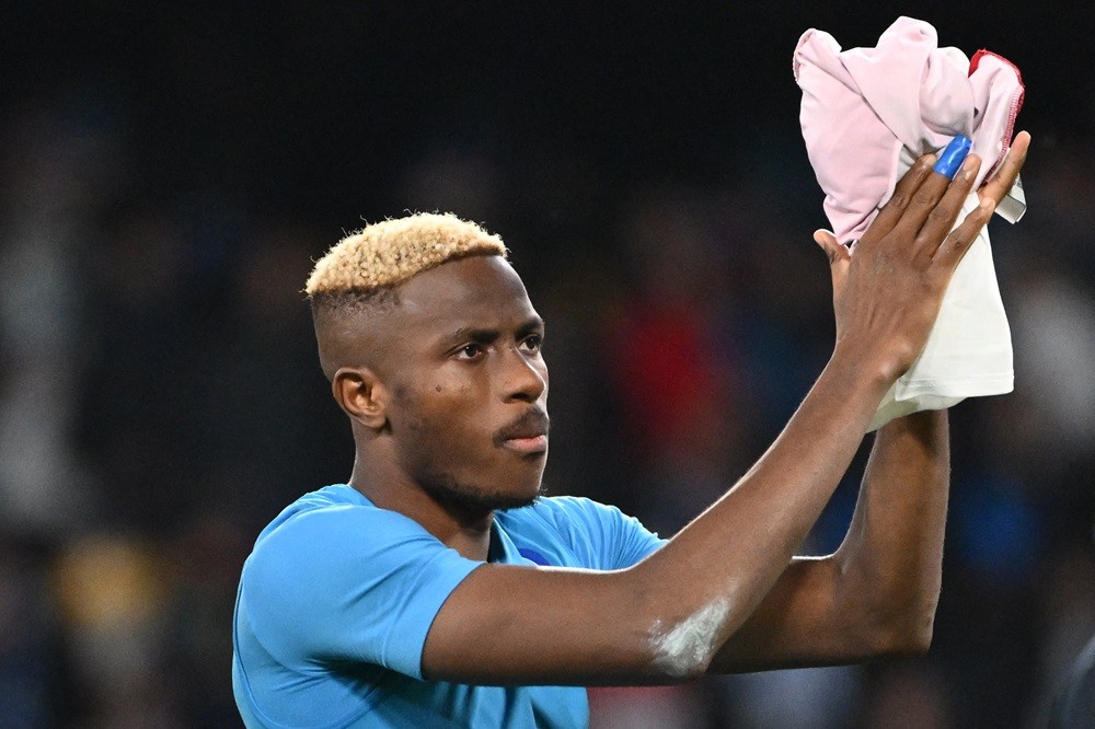 Napoli's Victor Osimhen celebrates after winning 2-0 the UEFA Champions League Group C football match Napoli vs Sporting Braga at the Diego Armando Maradona stadium in Naples on December 12, 2023. (Photo by ALBERTO PIZZOLI/AFP via Getty Images)