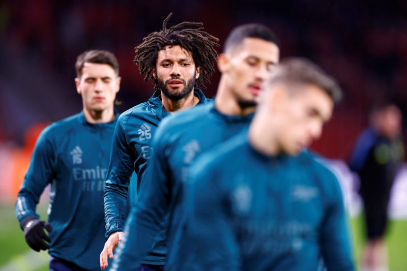 Arsenal's Egyptian midfielder #25 Mohamed Elneny and team mates warm up prior to a UEFA Champions League group B football match between PSV Eindhoven and Arsenal FC at the Philips Stadium in Eindhoven, on December 12, 2023. (Photo by KENZO TRIBOUILLARD/AFP via Getty Images)