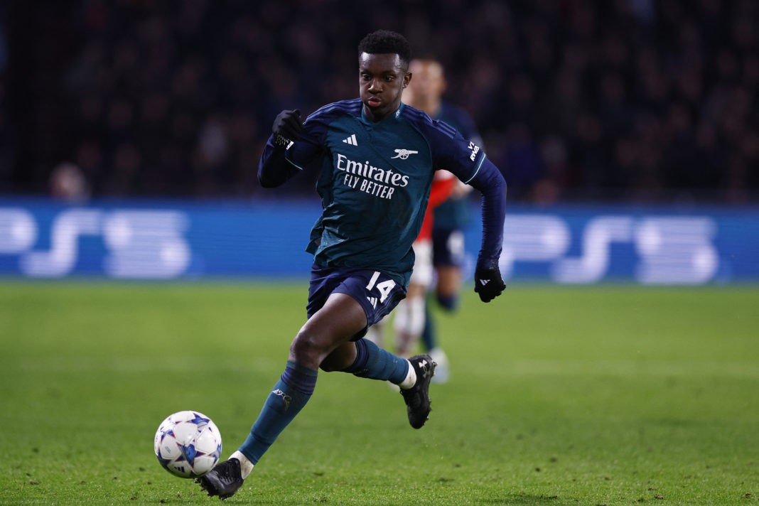 Arsenal's British forward #14 Eddie Nketiah controls the ball during a UEFA Champions League group B football match between PSV Eindhoven and Arsenal FC at the Philips Stadium in Eindhoven, on December 12, 2023. (Photo by KENZO TRIBOUILLARD/AFP via Getty Images)