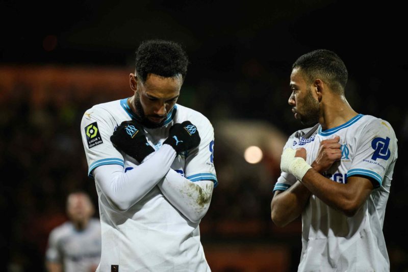 Marseille's French-Gabonese forward #10 Pierre-Emerick Aubameyang (L) celebrates after scoring a goal during the French L1 football match between FC Lorient and Olympique Marseille (OM) at the Stade du Moustoir in Lorient, western France, on December 10, 2023. (Photo by LOIC VENANCE/AFP via Getty Images)