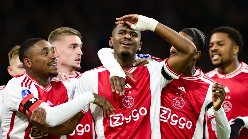 Ajax's Jorrel Hato (C) celebrates with team mates after scoring a goal during the Dutch Eredivisie football match between Ajax Amsterdam and Vitesse Arhem at the Johan-Cruijff ArenA on November 25, 2023 in Amsterdam. (Photo by OLAF KRAAK/ANP/AFP via Getty Images)