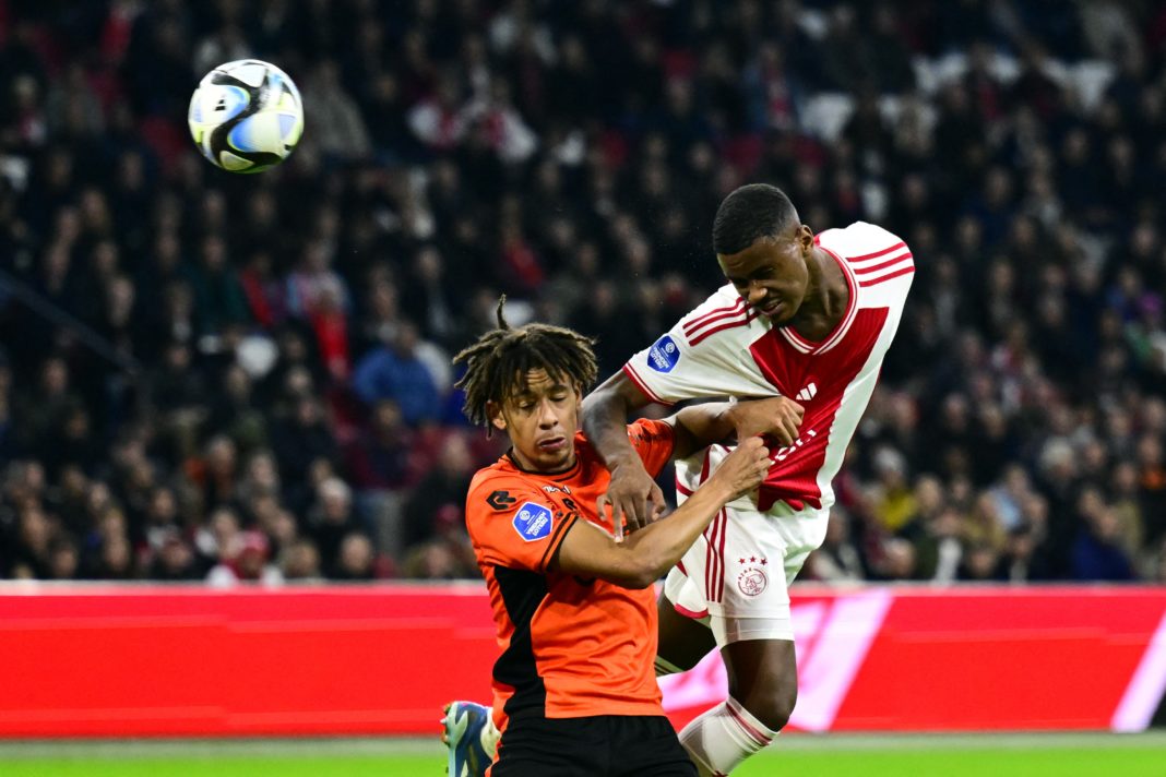 FC Volendam's Dutch defender #26 Deron Payne (L) fights for the ball with Ajax's Dutch defender #04 Jorrel Hato during the Dutch Eredivisie match between Ajax Amsterdam and FC Volendam at The Johan Cruijff ArenA in Amsterdam on November 2, 2023. (Photo by OLAF KRAAK/ANP/AFP via Getty Images)