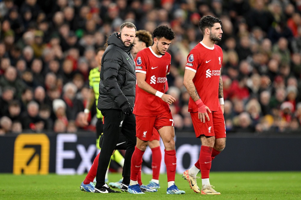 LIVERPOOL, ENGLAND: Luis Diaz of Liverpool leaves the field after sustaining an injury during the Premier League match between Liverpool FC and Arsenal FC at Anfield on December 23, 2023. (Photo by Michael Regan/Getty Images)