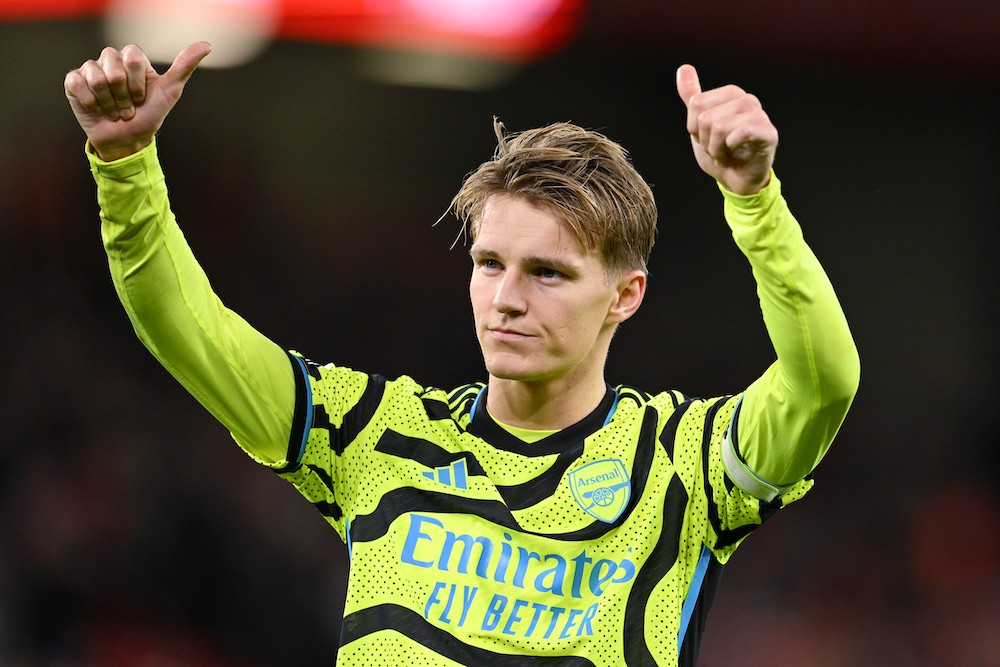 LIVERPOOL, ENGLAND: Martin Odegaard of Arsenal acknowledges the fans after the draw in the Premier League match between Liverpool FC and Arsenal FC at Anfield on December 23, 2023. (Photo by Michael Regan/Getty Images)